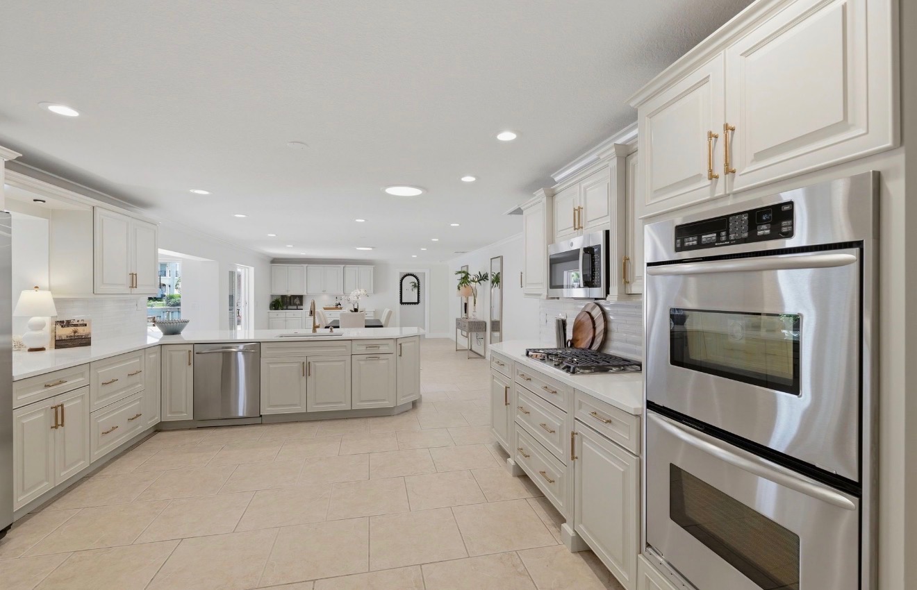 Renovated kitchen with modernized finishes and improved flow throughout the main living space in Venetian Isles, St. Petersburg, Florida
